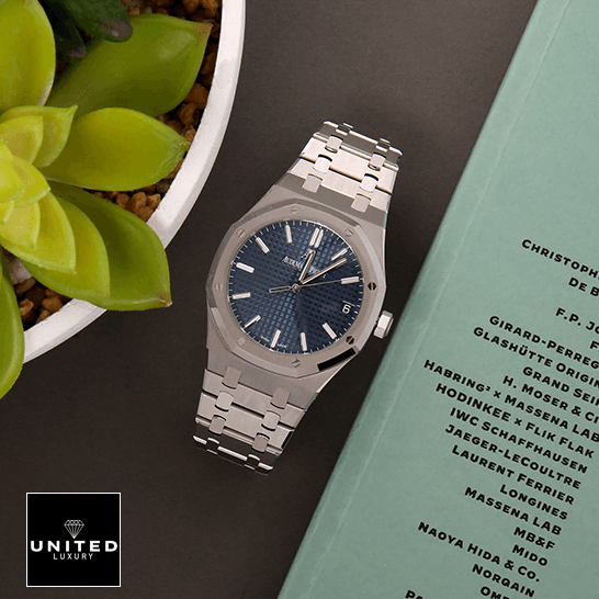 Audemars Piguet Royal Oak 15500ST "Blue Dial" Perfect Duplicate Edition audemars piguet royal oak15500ST.OO .1220ST.01 replica blue Audemars Piguet Royal Blue Dial Steel Bezel Replica next to flowers